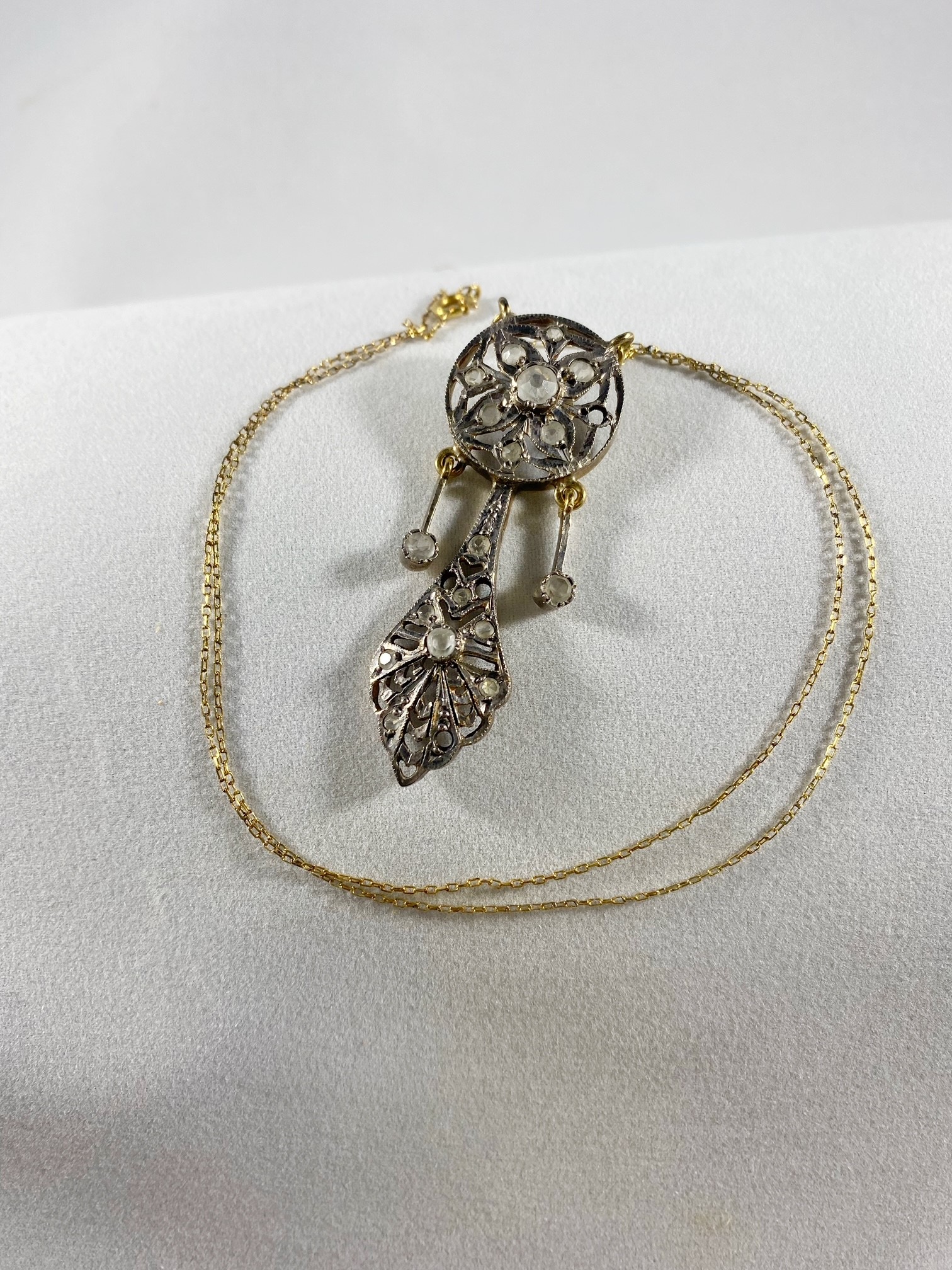 Lot 1063: Gold Colored Chain with Silver Colored Pendant with Clear Stones